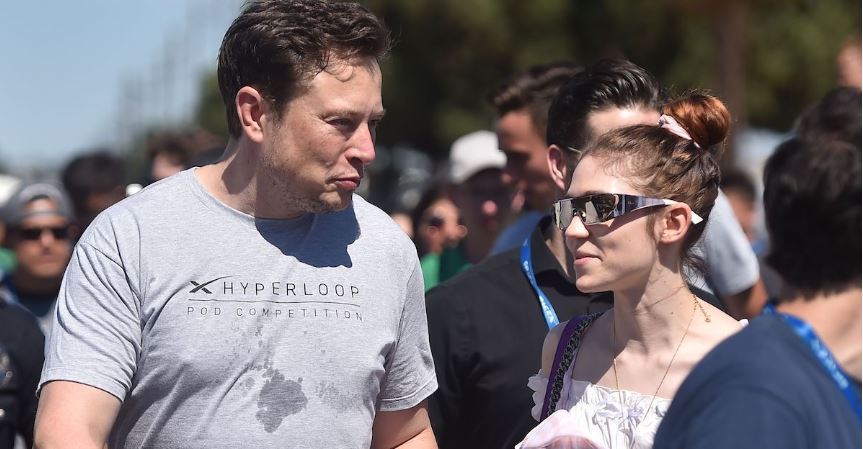 Elon Musk and Grimes casually walking
