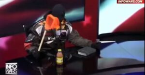What Was Kanye West Trying To Do With That Yoohoo Bottle and Net On Infowars?￼￼