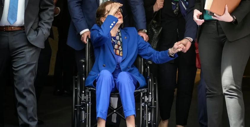 Sen. Dianne Feinstein (D-CA) is pushed in a wheelchair as she departs a business hearing of the Senate Judiciary Committee on Capitol Hill May 11, 2023.